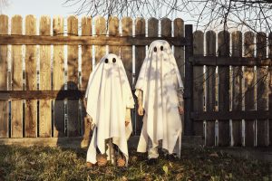 Two children dressed as ghosts